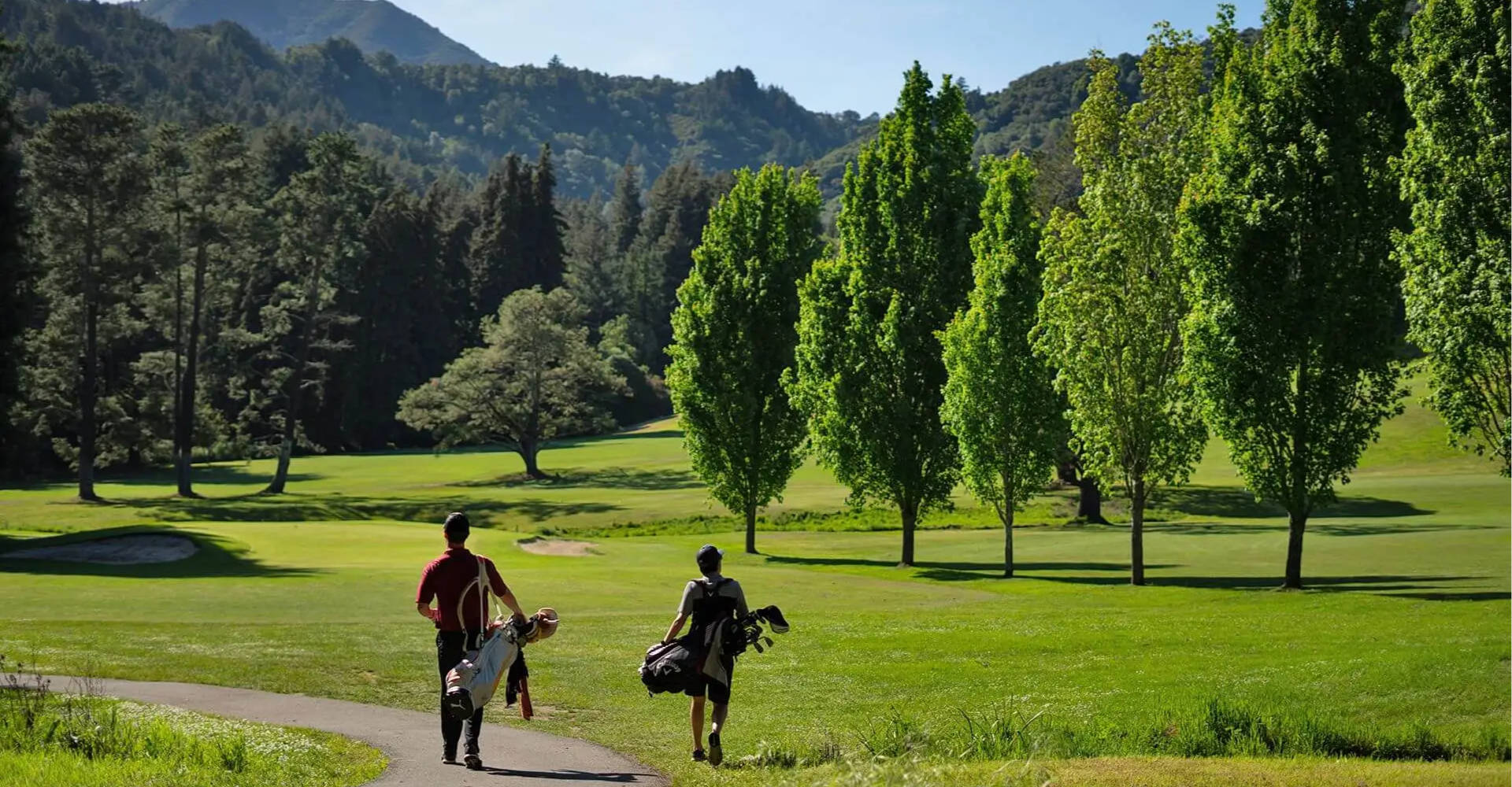 Junior golfers walking the fairway at Mill Valley Golf Course